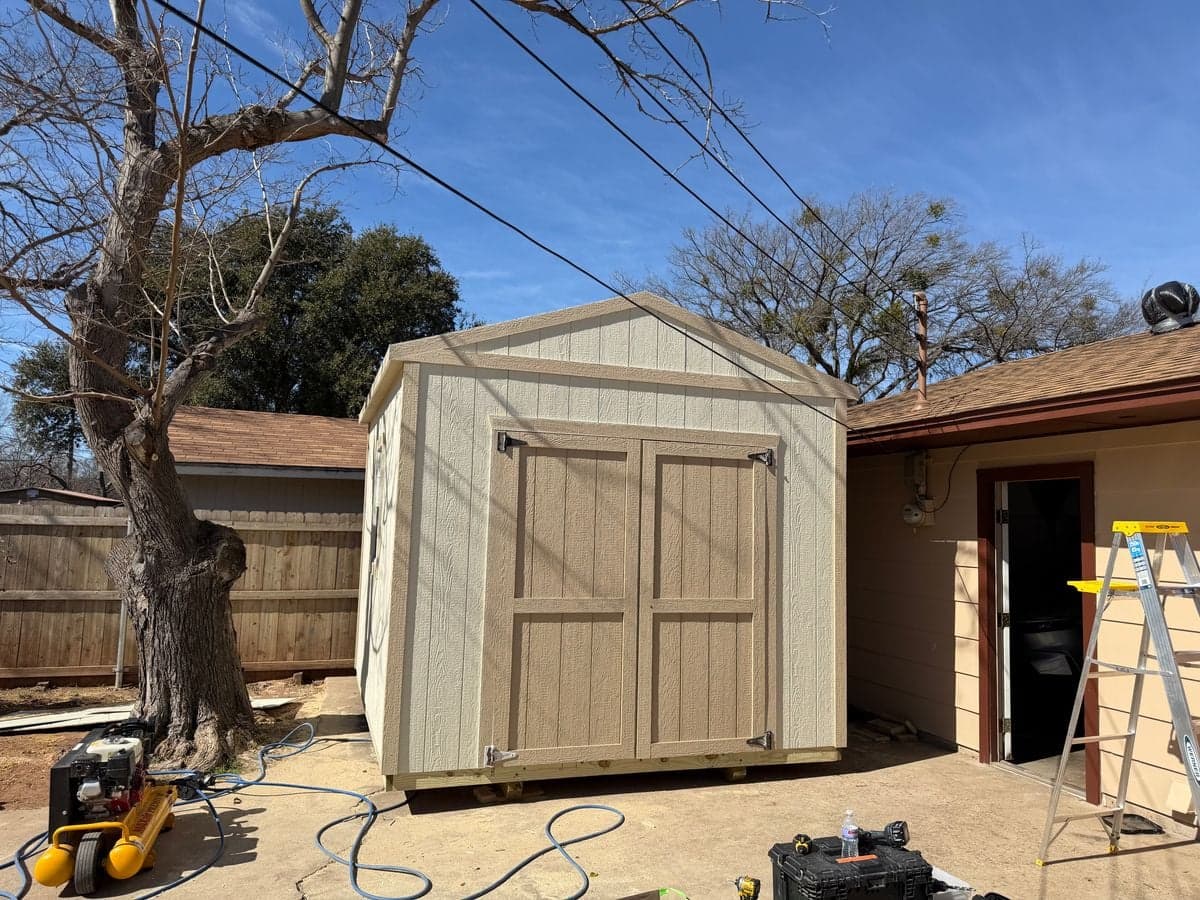 Shed nearly complete with roof, doors, and trim