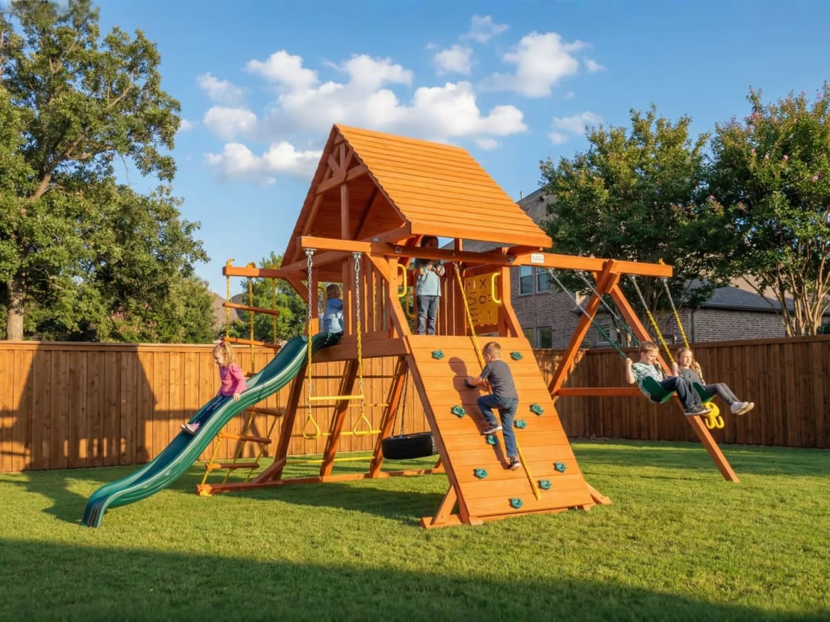 Playset installed in a suburban backyard