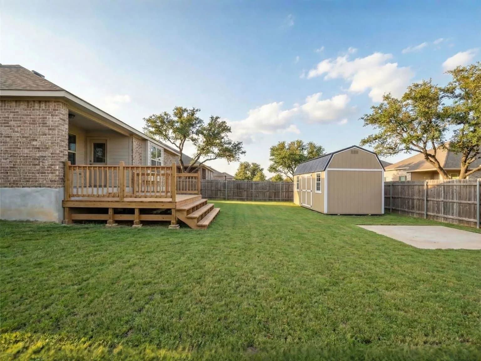Backyard transformed with a new shed and deck from North Texas Shed & Steel
